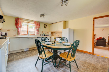 The spacious Kitchen/Dining Room has an electric cooker, dishwasher, washer/dryer, tumble dryer, combination microwave, fridge with icebox, bread-maker and coffee maker