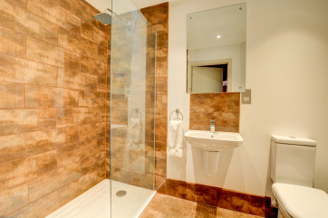 Bedroom 1 En-Suite with walk in shower, washbasin and wc