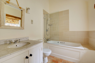 Bedroom 1 En-Suite with bath with over the shower bath, washbasin and wc