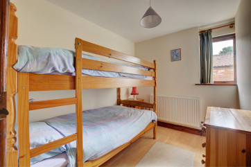 Lovely childrens room with pine bunk beds