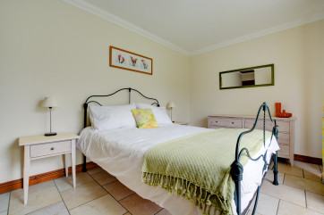 A comfortable kingsize bed in the spacious ground floor bedroom