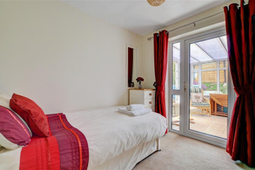 A single bedroom at the rear has a comfortable single pull out bed and leads into a conservatory with additional comfy seating