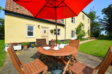 Colourful flower pots and shrubs on the patio.