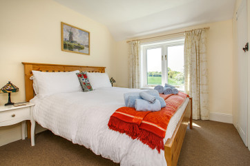 Bedroom 1 with a king-size bed and bedside tables