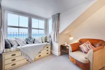 Master bedroom with window seat & sea views 