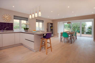 Extremely spacious kitchen & dining room with views over the large sunny terrace & gardens below