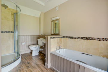 A generous size en-suite where you can enjoy a relaxing soak in the bath after a fun packed day.