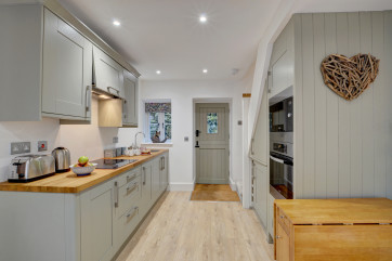A stylish kitchen area has been well designed and offers all you need to enjoy preparing meals
