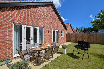 Rear garden with patio table and chairs