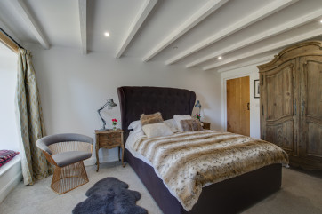 Ground floor bedroom with a king size bed and en suite shower room