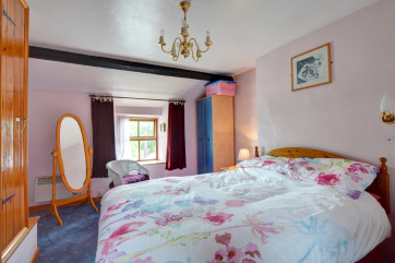 A comfortable carpeted bedroom