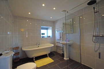 Ground floor bathroom with freestanding bath & wet-room style shower