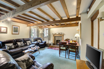 Lounge with open fire and beamed ceiling