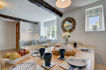 Enjoy meals together around the dining table which comfortably seats five people