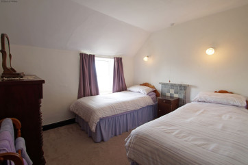 One of two twin bedrooms, also with a sea view