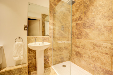 Bedroom 2 En-Suite with walk in shower, washbasin and wc