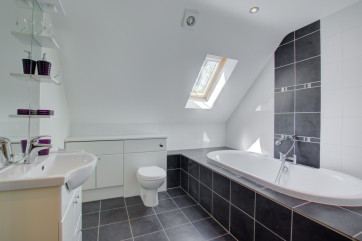 With sunken bath and velux window