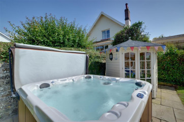 The added benefit of a hot tub in the garden provides an ideal spot for relaxing 