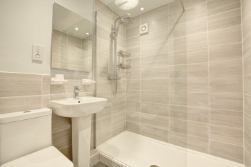 Bedroom 1 En-Suite with shower over the bath, washbasin and wc