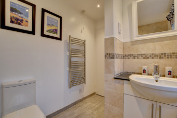A separate modern bathroom with white suite completes the accommodation