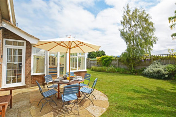 Lovely lawned garden with patio area