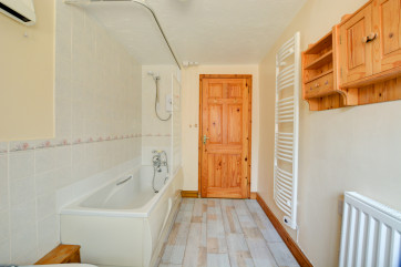 The Bathroom has a bath, over-bath electric shower, washbasin, bidet and wc 