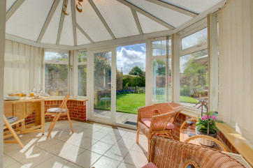 Light and airy conservatory with cane seating, a pleasant additional seating area