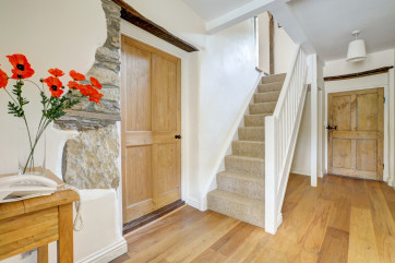 The hallway has exposed brickwork