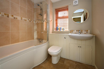 Family bathroom on the ground floor with electric shower over the bath