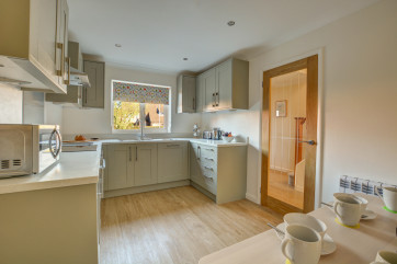 Kitchen showing some dining area