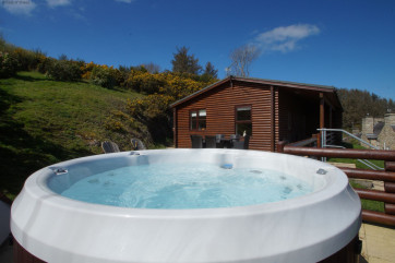 Relax for hours on the patio at Gorwel Log Cabin North Wales