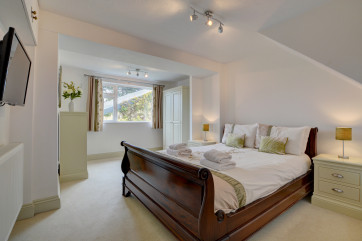 The downstairs double bedroom with bathroom adjacent 