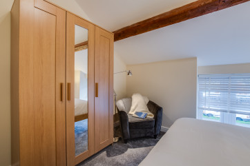 Reading chair and lamp in the main bedroom