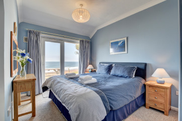Master bedroom with patio doors onto the terrace