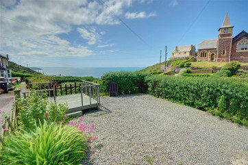 Decking in front of the cottage and ample parking 