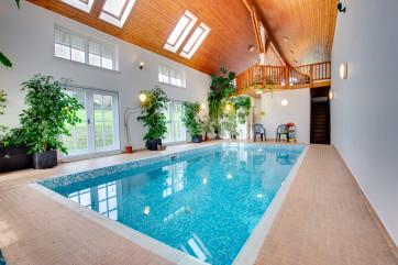 A stunning private pool with large indoor sun balcony.