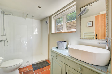 Bedroom 2 En-Suite showing shower, basin and wc