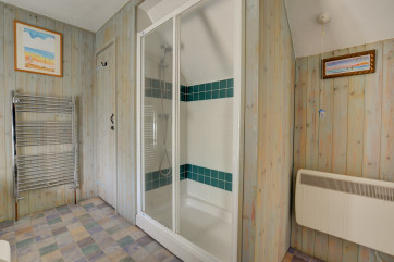 A well equipped bathroom with bath and seperate shower cubicle.