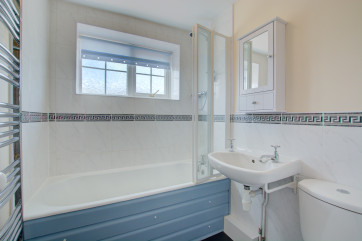 Complete with over-bath shower and folding screen.