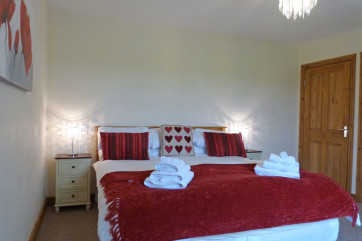 Bedroom 5: Super king size bed. Luxury self catering in North Wales