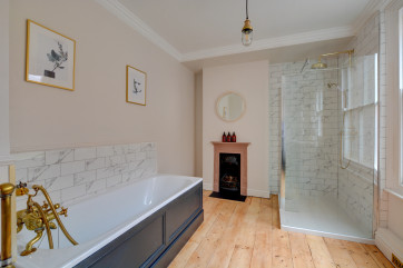 First floor bathroom with feature fireplace