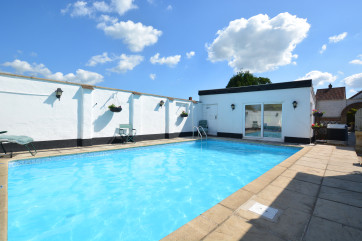 This property has the added luxury of an outdoor swimming pool!