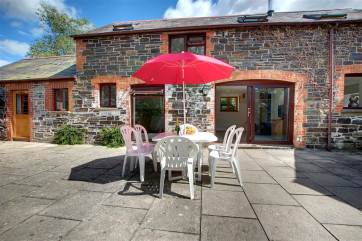 Large and fully enclosed sun trap courtyard ideal for relaxation and al fresco dining