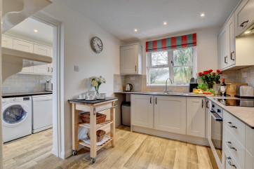 The well equipped kitchen and utility room have everything you need