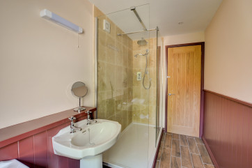 The annexe bedroom has its own shower room