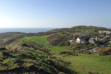 Tucked into the hillside on the edge of the village of Mortehoe with magnificent views 