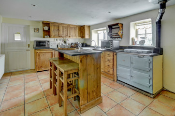 A country style kitchen offers everything you will need to prepare meals for family and friends