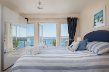 Master bedroom ensuite with doors to the balcony