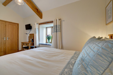 The master bedroom has lovely countryside views