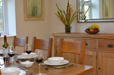 Dining table set for dinner